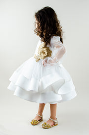 Handmade short white flower girl's dress with a multi-layered tutu skirt, golden embroidery and a big bow on the back