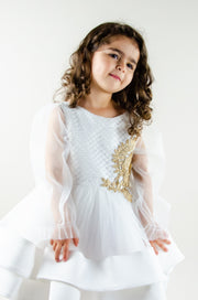 Handmade short white flower girl's dress with a multi-layered tutu skirt, golden embroidery and a big bow on the back