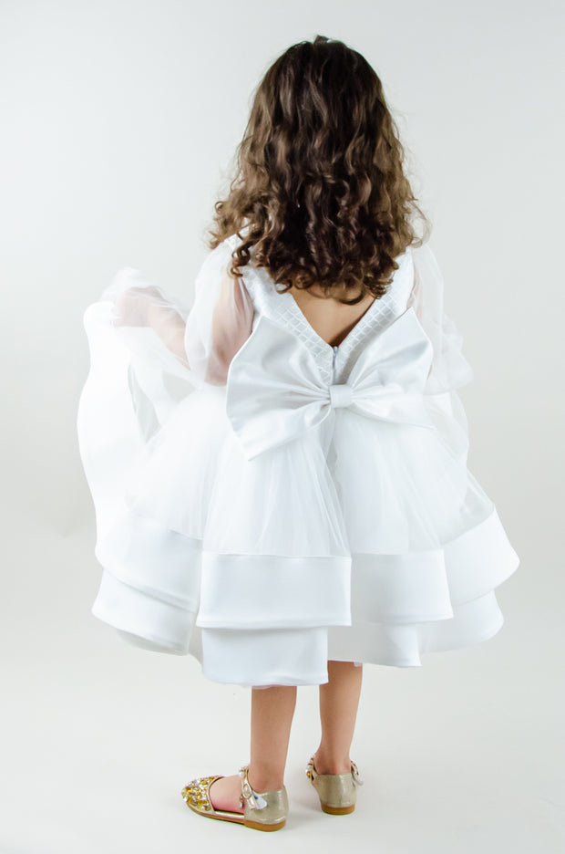 Short white flower girl dress with a multi-layer tutu skirt, transparent sleeves and 3D floral embroidery in gold. The dress is for weddings, birthdays, parties, flower girls and other special formal events and occasions.