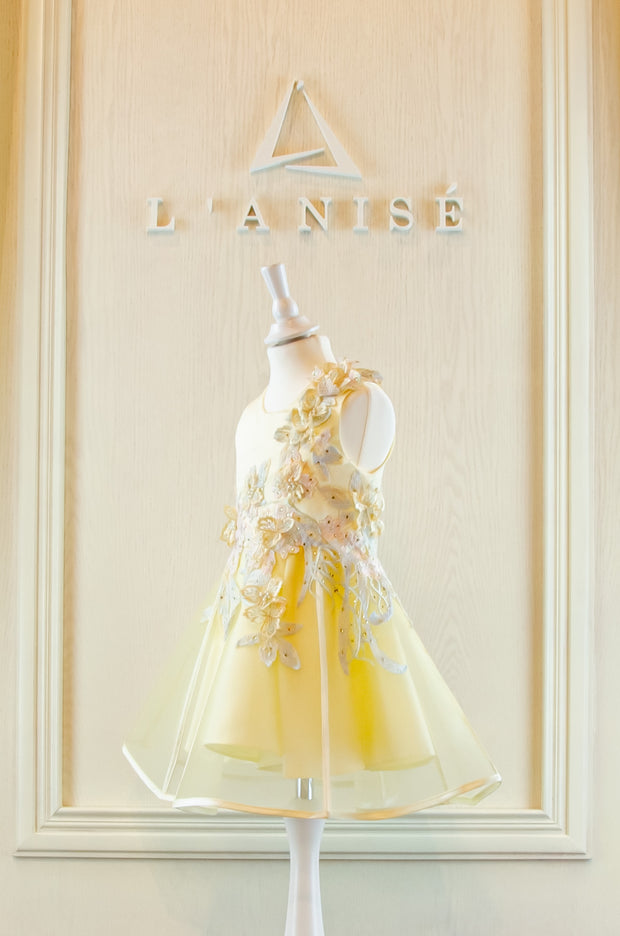 handmade short A-line yellow flower girl dress with a short tulle skirt and hand embroidered top with pastel flowers, pearls and rhinestones