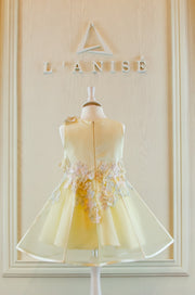 handmade short A-line yellow flower girl dress with a short tulle skirt and hand embroidered top with pastel flowers, pearls and rhinestones