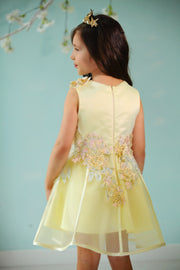 handmade short A-line yellow flower girl dress with a short tulle skirt and hand embroidered top with pastel flowers, pearls and rhinestones