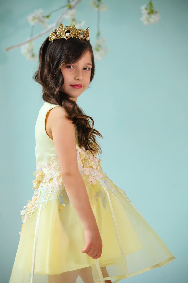 handmade short A-line yellow flower girl dress with a short tulle skirt and hand embroidered top with pastel flowers, pearls and rhinestones