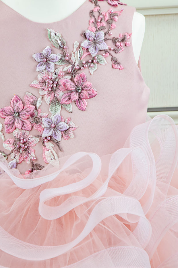 handmade, blush pink flower girl dress with a voluminous, multi-layer tulle skirt with floral embroidery