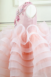 handmade, blush pink flower girl dress with a voluminous, multi-layer tulle skirt with floral embroidery