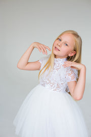 handmade, white princess girl dress with a high low hemline, short white tutu, tulle train, lace top, short sleeves and feather details.