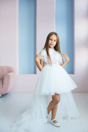 handmade, white princess girl dress with a high low hemline, short white tutu, tulle train, lace top, short sleeves and feather details.