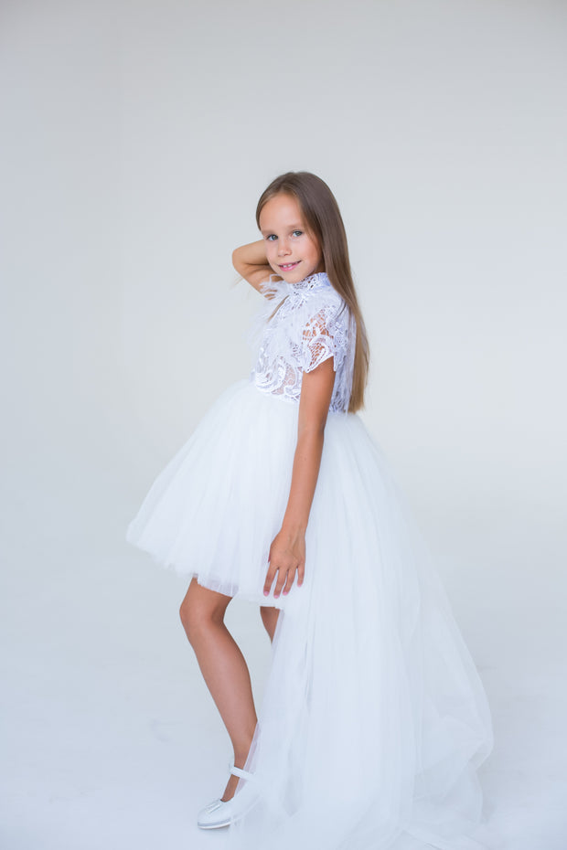 handmade, white princess girl dress with a high low hemline, short white tutu, tulle train, lace top, short sleeves and feather details.