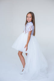 handmade, white princess girl dress with a high low hemline, short white tutu, tulle train, lace top, short sleeves and feather details.