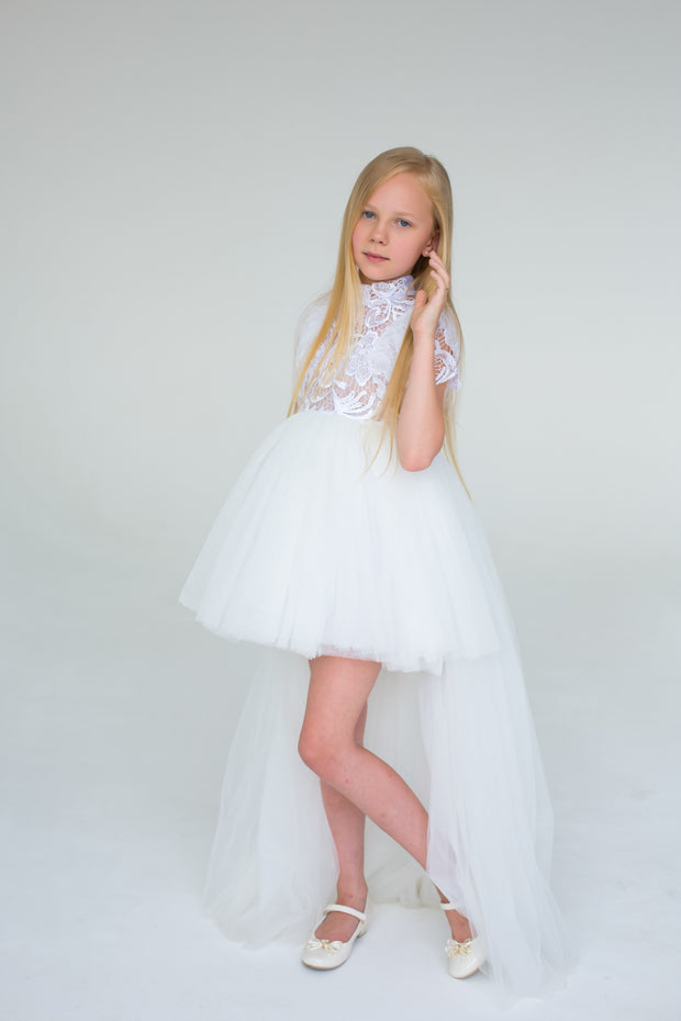 handmade, white princess girl dress with a high low hemline, short white tutu, tulle train, lace top, short sleeves and feather details.