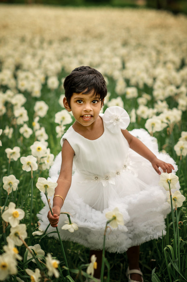 Short white princess tutu dress with tulle skirt, pleated top and floral embellishment, for special occasions: Wedding, Birthday party, Prom, Flower girl, Eid, and other events. 