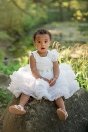 Short white princess tutu dress with tulle skirt, pleated top and floral embellishment, for special occasions: Wedding, Birthday party, Prom, Flower girl, Eid, and other events. 