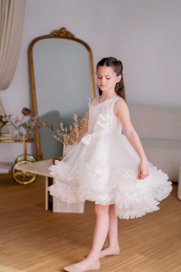 Voluminous, midi white tulle dress with tulle ruffle details, tulle top with sequin embroidery and a big bow accent at the waistline. Handmade with love. For special occasions: Wedding, Birthday party, Prom, Flower girl, Eid, and other events.