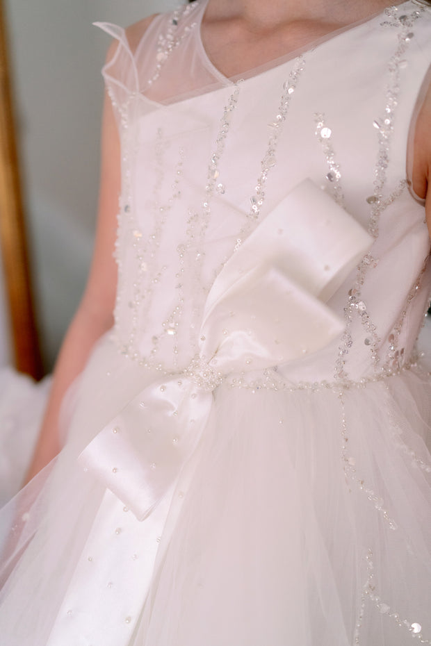 Voluminous, midi white tulle dress with tulle ruffle details, tulle top with sequin embroidery and a big bow accent at the waistline. Handmade with love. For special occasions: Wedding, Birthday party, Prom, Flower girl, Eid, and other events.