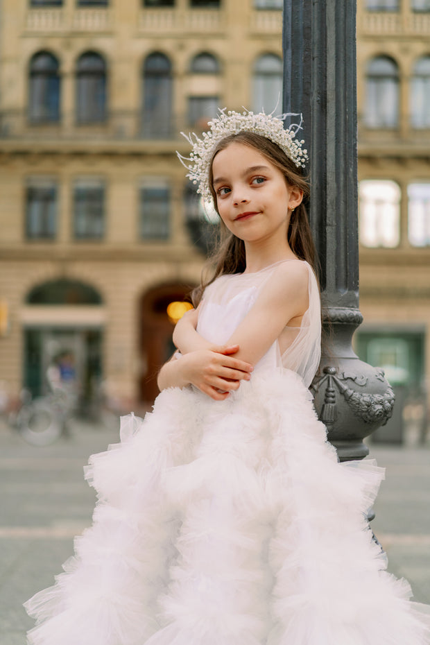 Enchanting fairy tale princess look with a long, white ball gown with voluminous skirt with tulle ruffles and open back. Occasions: Wedding, Birthday party, Prom, Flower girl, Eid, and other events.