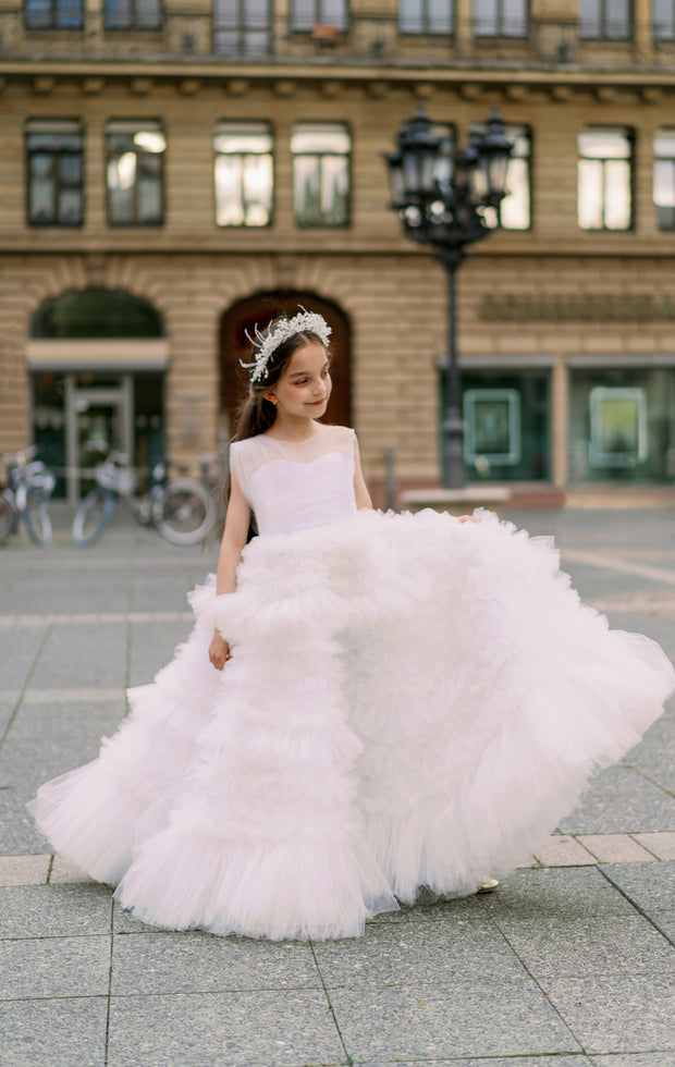 Enchanting fairy tale princess look with a long, white ball gown with voluminous skirt with tulle ruffles and open back. Occasions: Wedding, Birthday party, Prom, Flower girl, Eid, and other events.