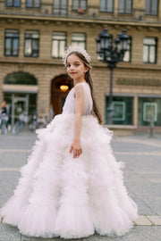 Enchanting fairy tale princess look with a long, white ball gown with voluminous skirt with tulle ruffles and open back. Occasions: Wedding, Birthday party, Prom, Flower girl, Eid, and other events.