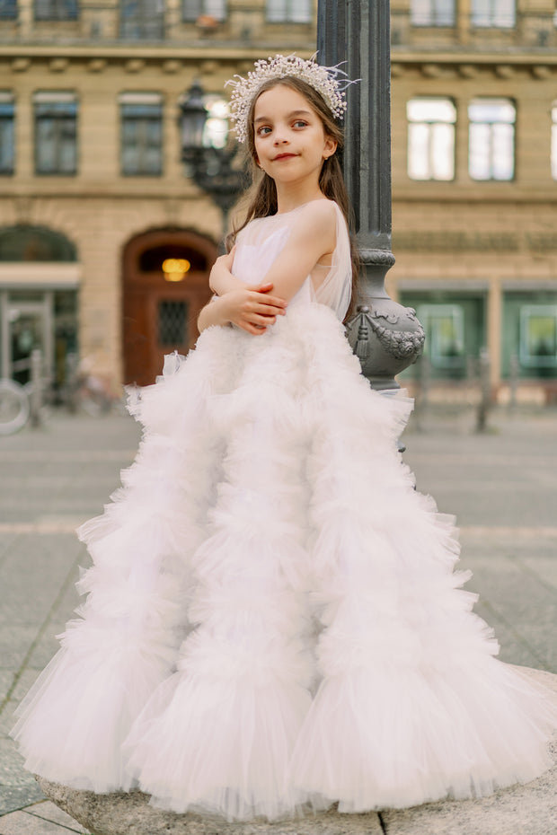 Enchanting fairy tale princess look with a long, white ball gown with voluminous skirt with tulle ruffles and open back. Occasions: Wedding, Birthday party, Prom, Flower girl, Eid, and other events.