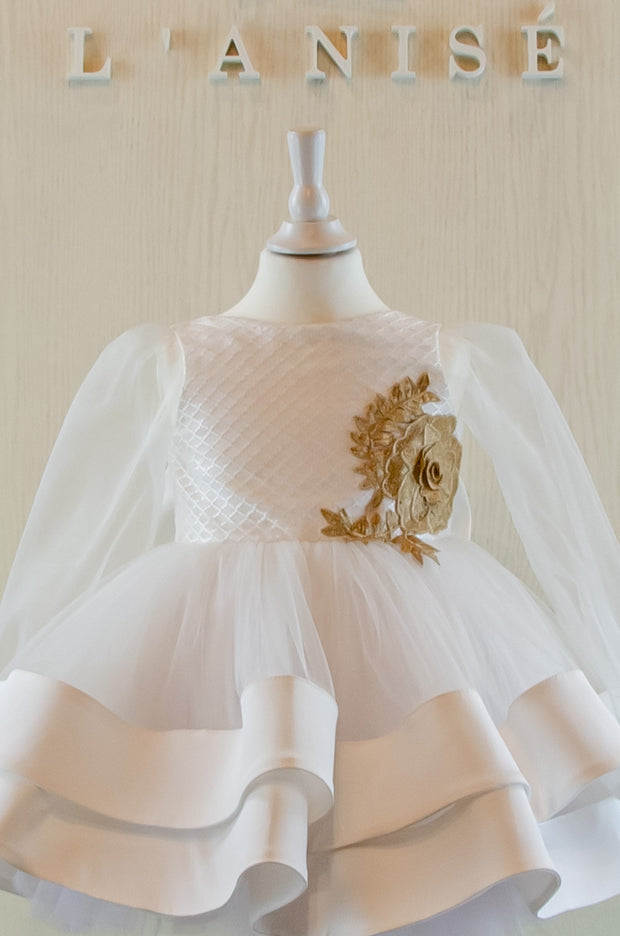 Handmade short white flower girl's dress with a multi-layered tutu skirt, golden embroidery and a big bow on the back