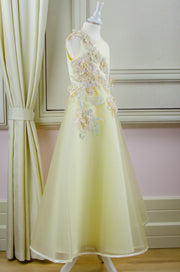 handmade long yellow A-line flower girl dress with a long tulle skirt and hand-embroidered top with flowers, pearls and rhinestones.